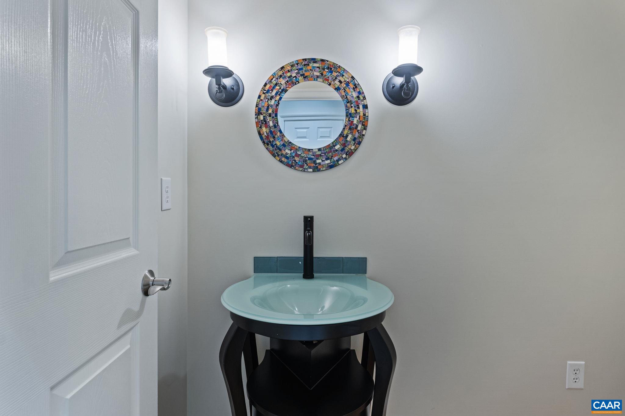 2025 Farringdon Road Keswick, VA 22947 - Photo 36 of 55 a bathroom with a sink and a mirror
