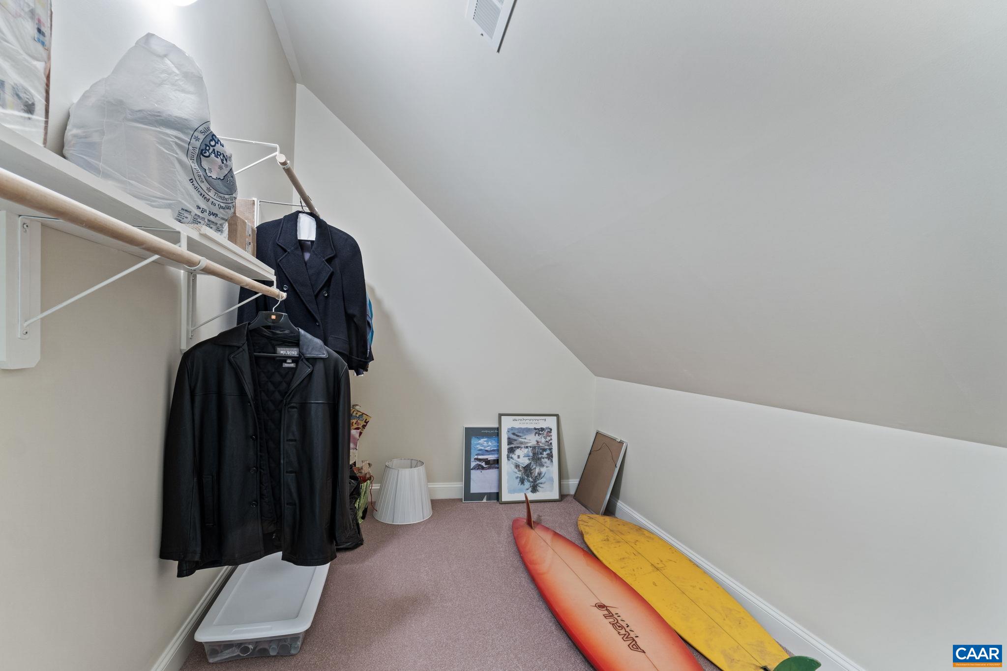 2025 Farringdon Road Keswick, VA 22947 - Photo 45 of 55 a view of walk in closet with clothes and shoes