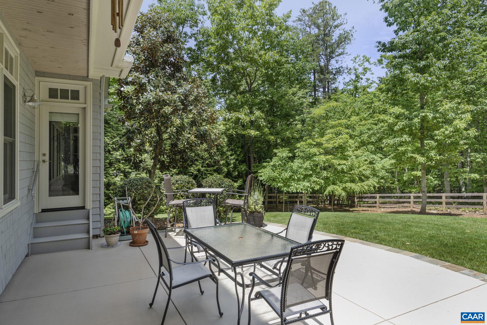 2025 Farringdon Road Keswick, VA 22947 - Photo 53 of 55 a patio with table and chairs and potted plants