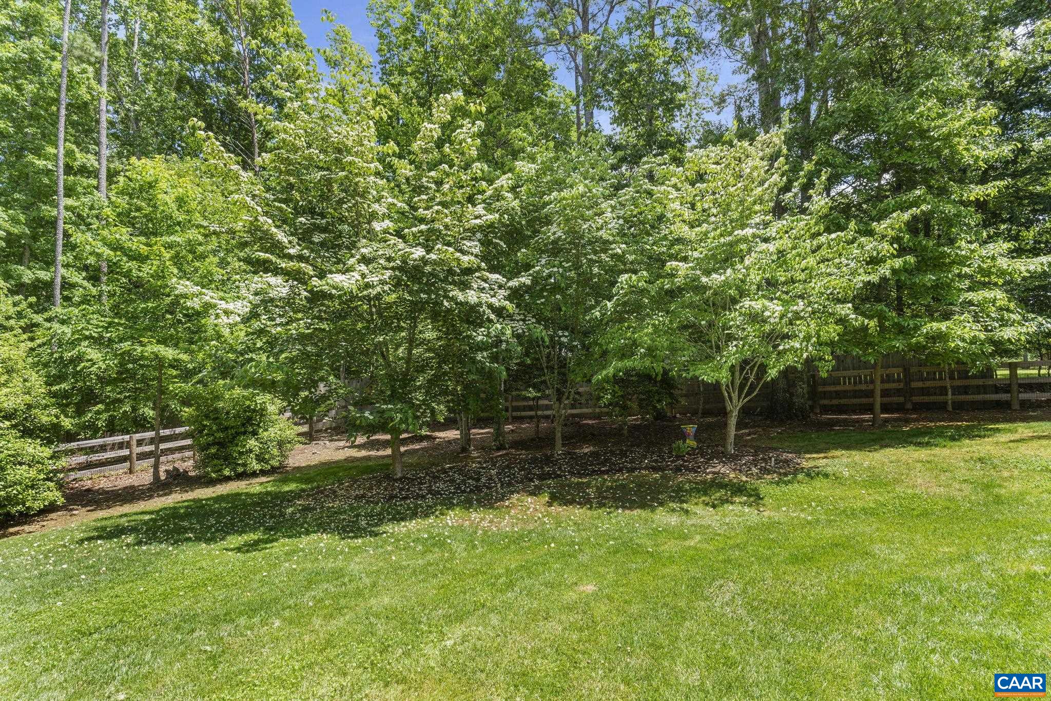 2025 Farringdon Road Keswick, VA 22947 - Photo 54 of 55 a backyard of a house with lots of green space and fountain