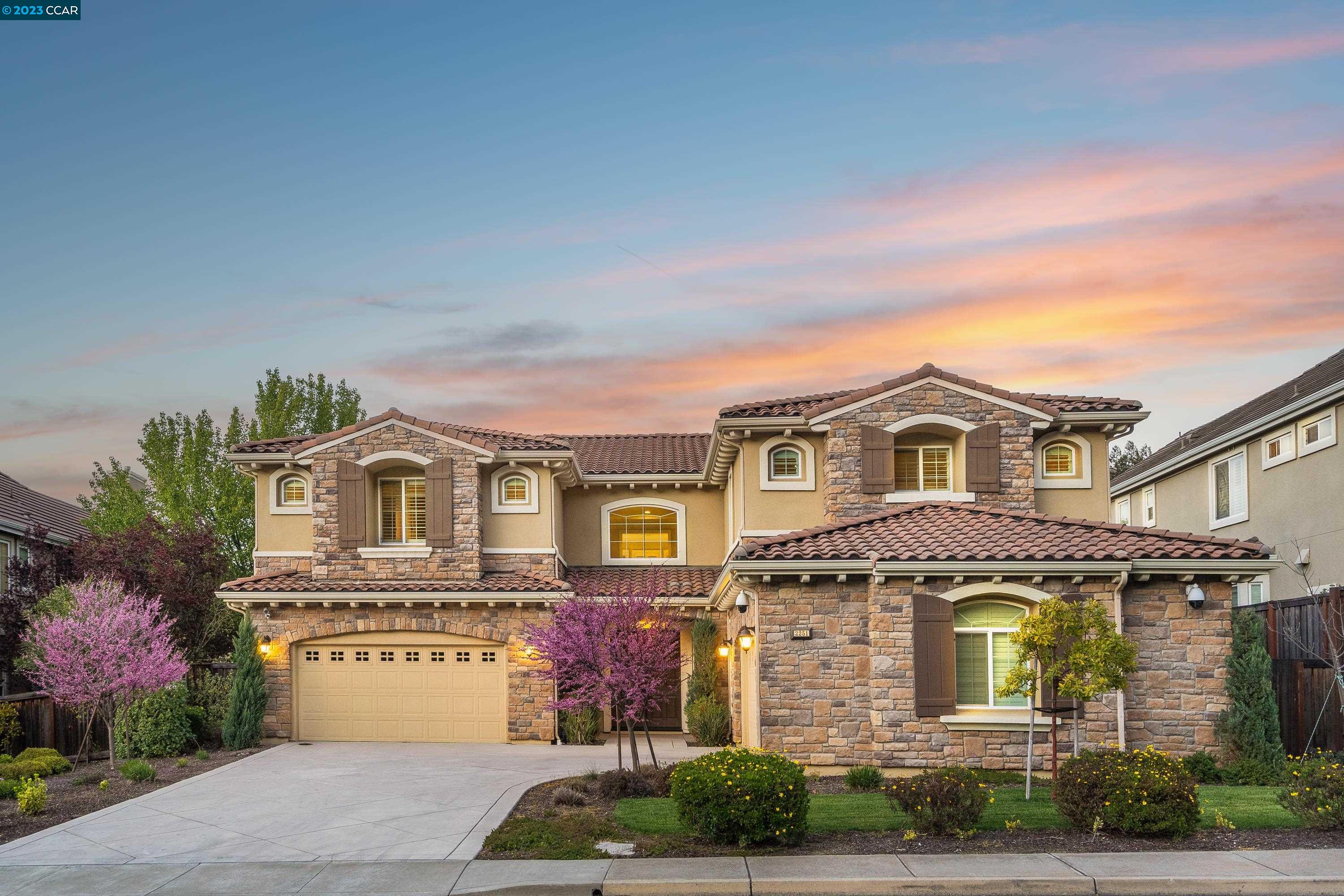 2251 Ashbourne Drive San Ramon, CA 94583 - Photo 1 of 1 a front view of a house with a garden