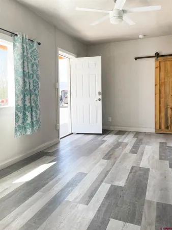 a view of an empty room with a window