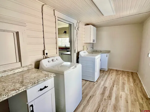 a storage room with washer and dryer