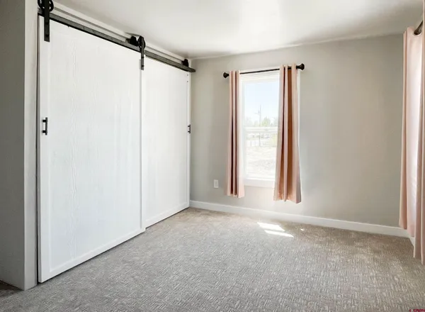 a view of a window in an empty room