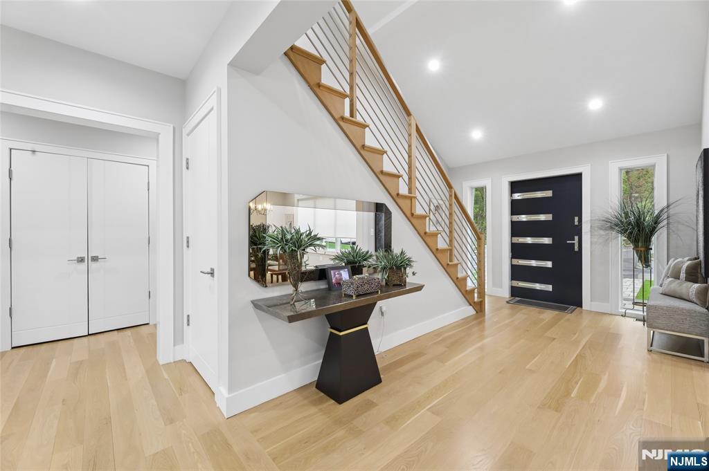 31 Engleside Street Cresskill, NJ 07626 - Photo 4 of 49 a view of a hallway with wooden floor and staircase