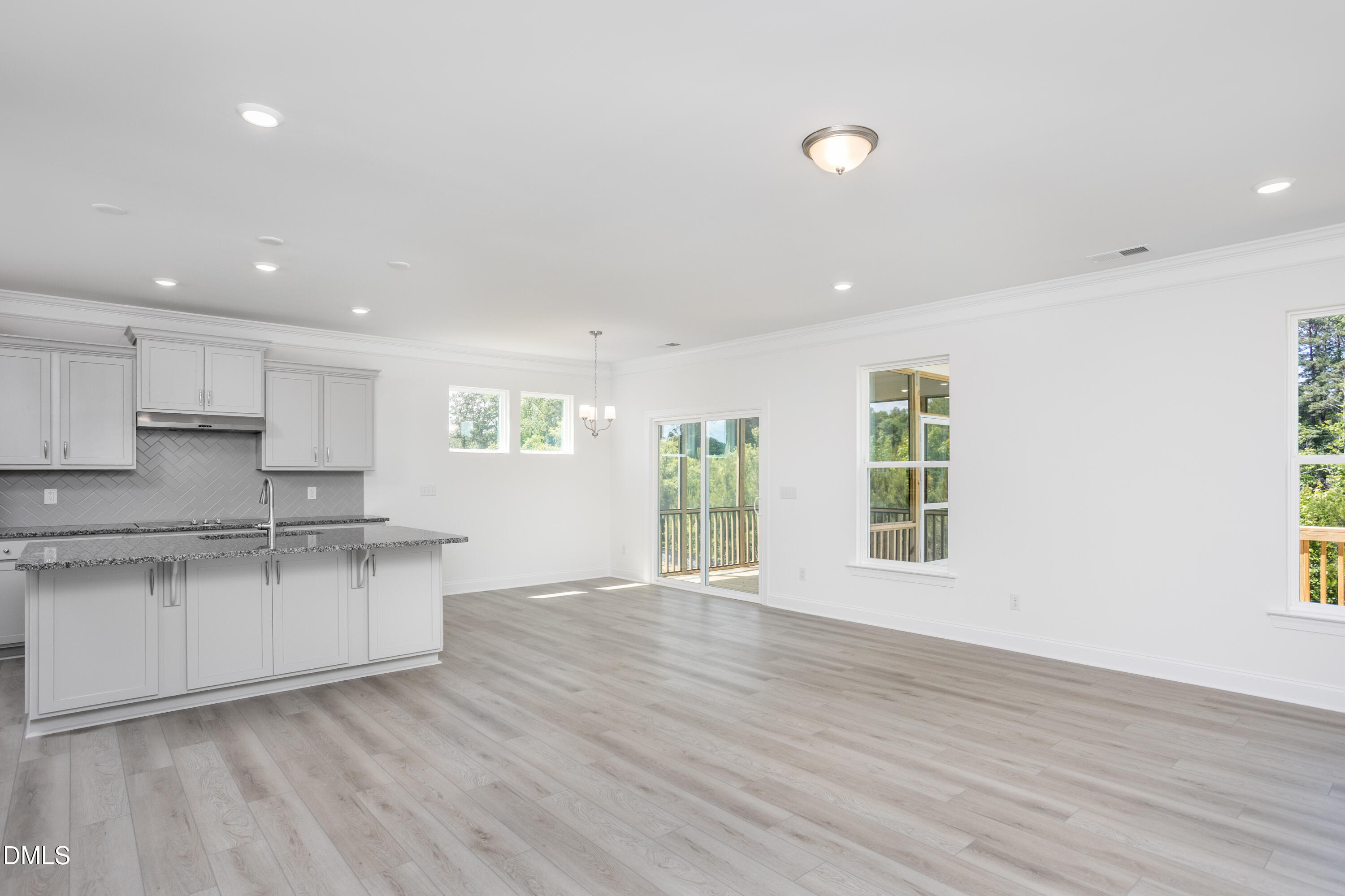 216 Cedar Rdg Trail Angier, NC 27501 - Photo 16 of 33 a kitchen with stainless steel appliances granite countertop a stove and a wooden floors