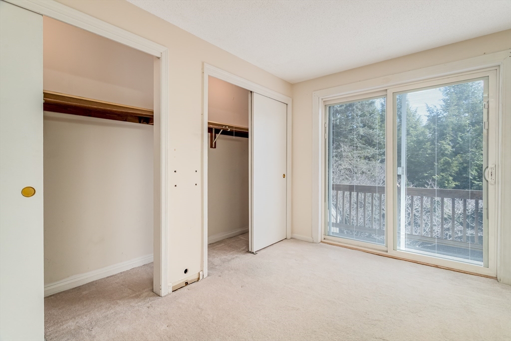 164 Ayer Road, Unit F4 Shirley, MA 01464 - Photo 15 of 34 a view of empty room with floor to ceiling window