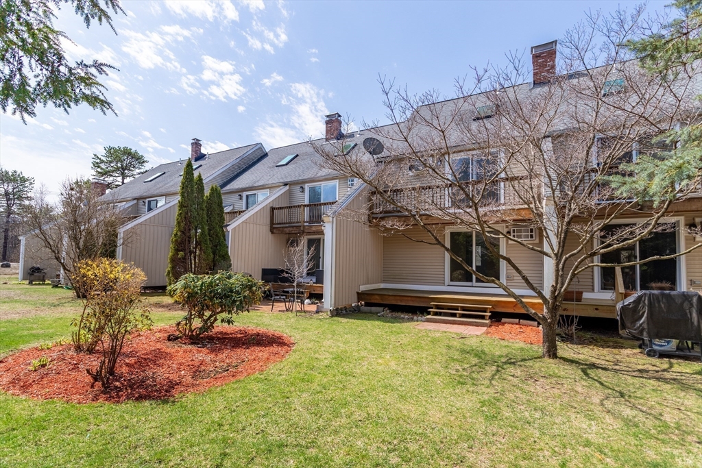 164 Ayer Road, Unit F4 Shirley, MA 01464 - Photo 29 of 34 a front view of house with yard