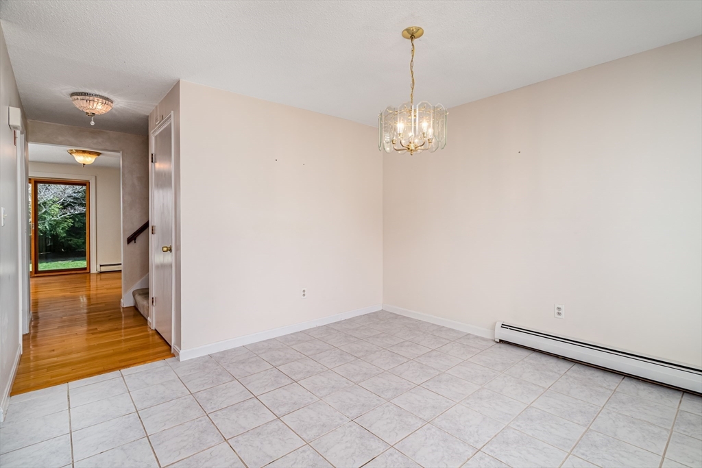 164 Ayer Road, Unit F4 Shirley, MA 01464 - Photo 3 of 34 a view of empty room with wooden floor