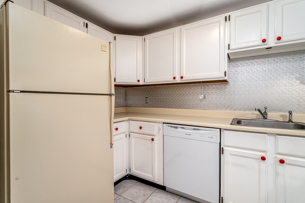 164 Ayer Road, Unit F4 Shirley, MA 01464 - Photo 5 of 34 a white refrigerator freezer sitting inside of a kitchen