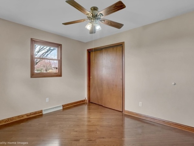 736 Schoolgate Road New Lenox, IL 60451 - Photo 14 of 24 an empty room with fan and windows