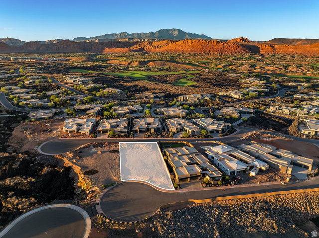0 St. George, UT 84770 - Photo 10 of 25 Developable lot with a clear building envelope, surrounded by modern residences and natural desert landscaping, featuring paved roads and distant red rock formations