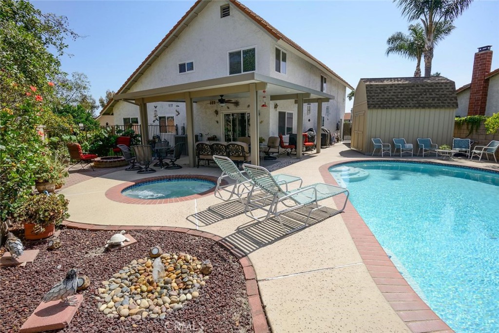 10424 Cartilla Court Rancho Cucamonga, CA 91737 - Photo 33 of 36 a view of a house with backyard porch and sitting area