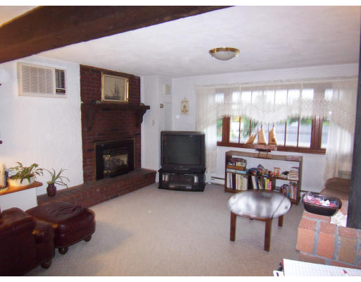 267 Ridge Street Arlington, MA 02474 - Photo 13 of 18 a living room with furniture and a fireplace