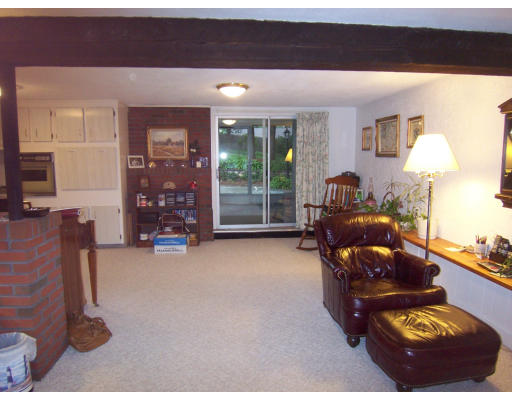 267 Ridge Street Arlington, MA 02474 - Photo 14 of 18 a living room with furniture and a lamp