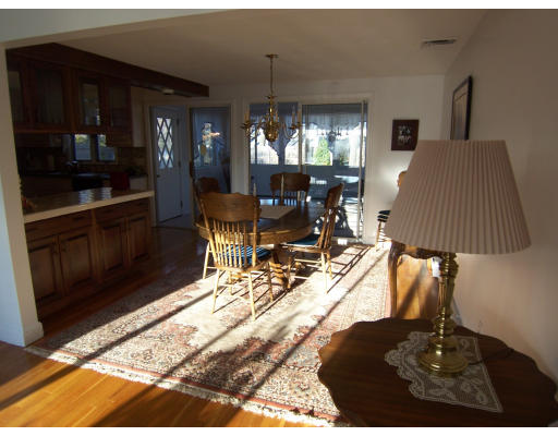 267 Ridge Street Arlington, MA 02474 - Photo 5 of 18 a view of a dining room with a table and chairs
