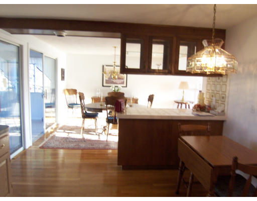 267 Ridge Street Arlington, MA 02474 - Photo 7 of 18 a kitchen with a sink cabinets and dining table
