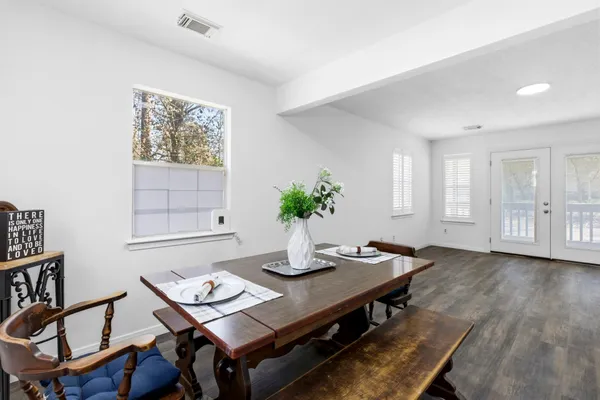 a view of a dining room with furniture window and wooden floor