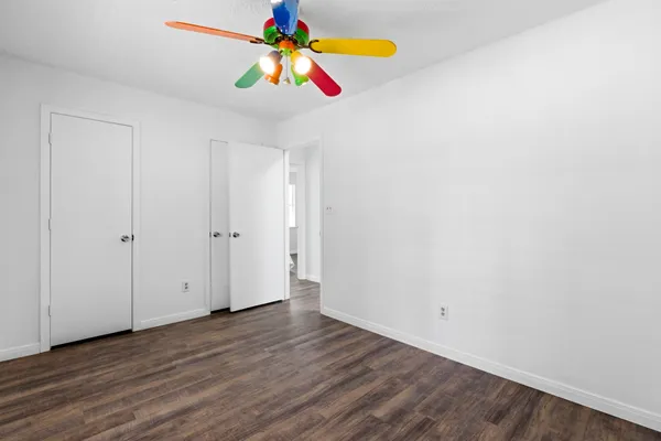 a view of an entryway with wooden floor