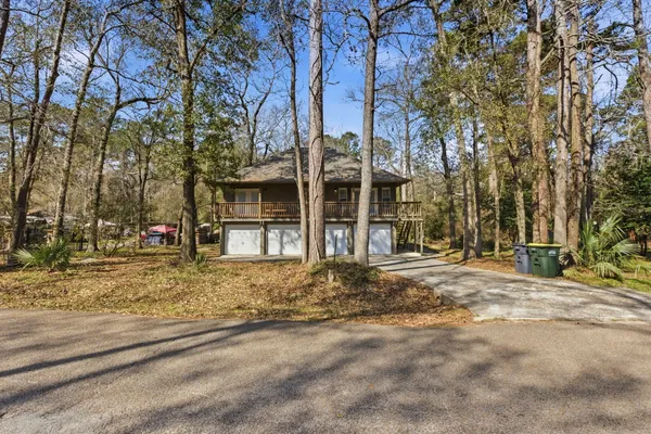 front view of a house with a large trees