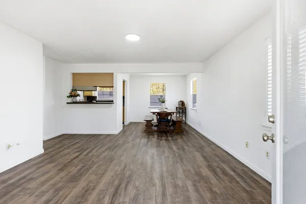 a view of kitchen with sink and wooden floor