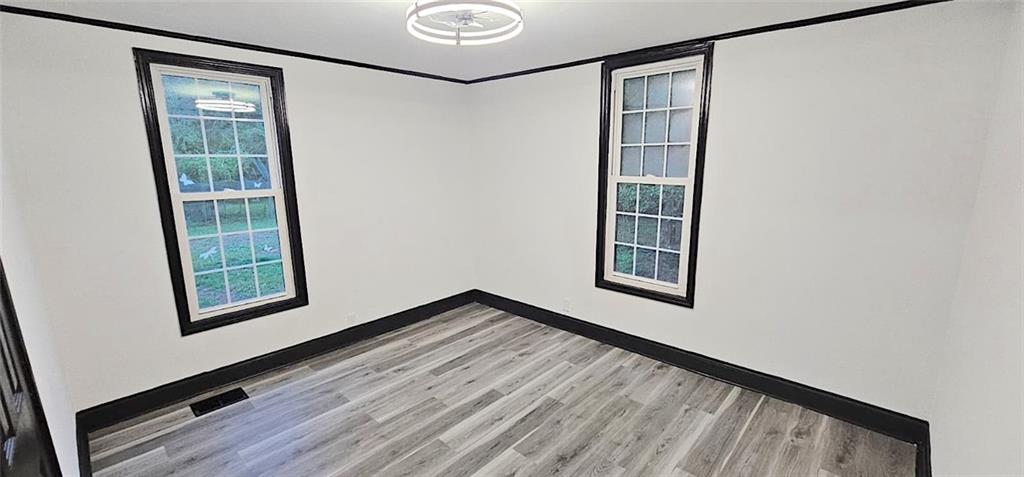 2895 Turner Church Road McDonough, GA 30252 - Photo 17 of 25 a view of an empty room with a window and wooden floor