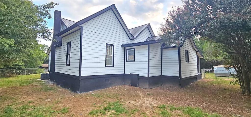 2895 Turner Church Road McDonough, GA 30252 - Photo 23 of 25 a view of a house with a yard and large tree