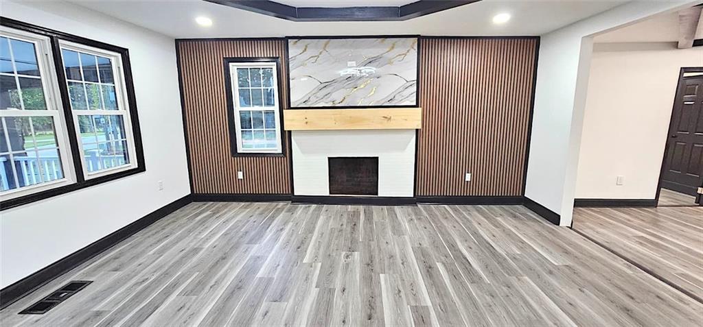 2895 Turner Church Road McDonough, GA 30252 - Photo 5 of 25 a view of an empty room with wooden floor and a window