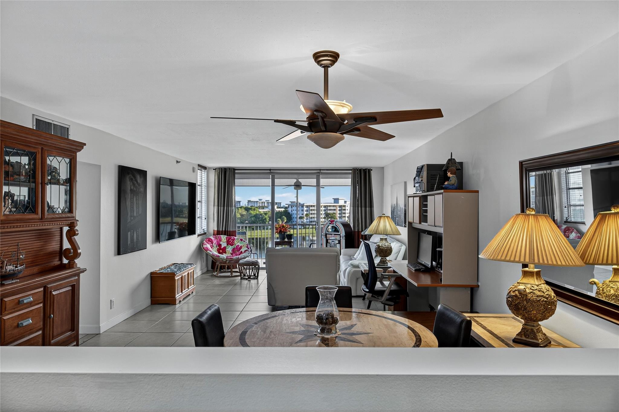 2900 North Course Drive, Unit 607 Pompano Beach, FL 33069 - Photo 16 of 48 a living room with furniture and a window