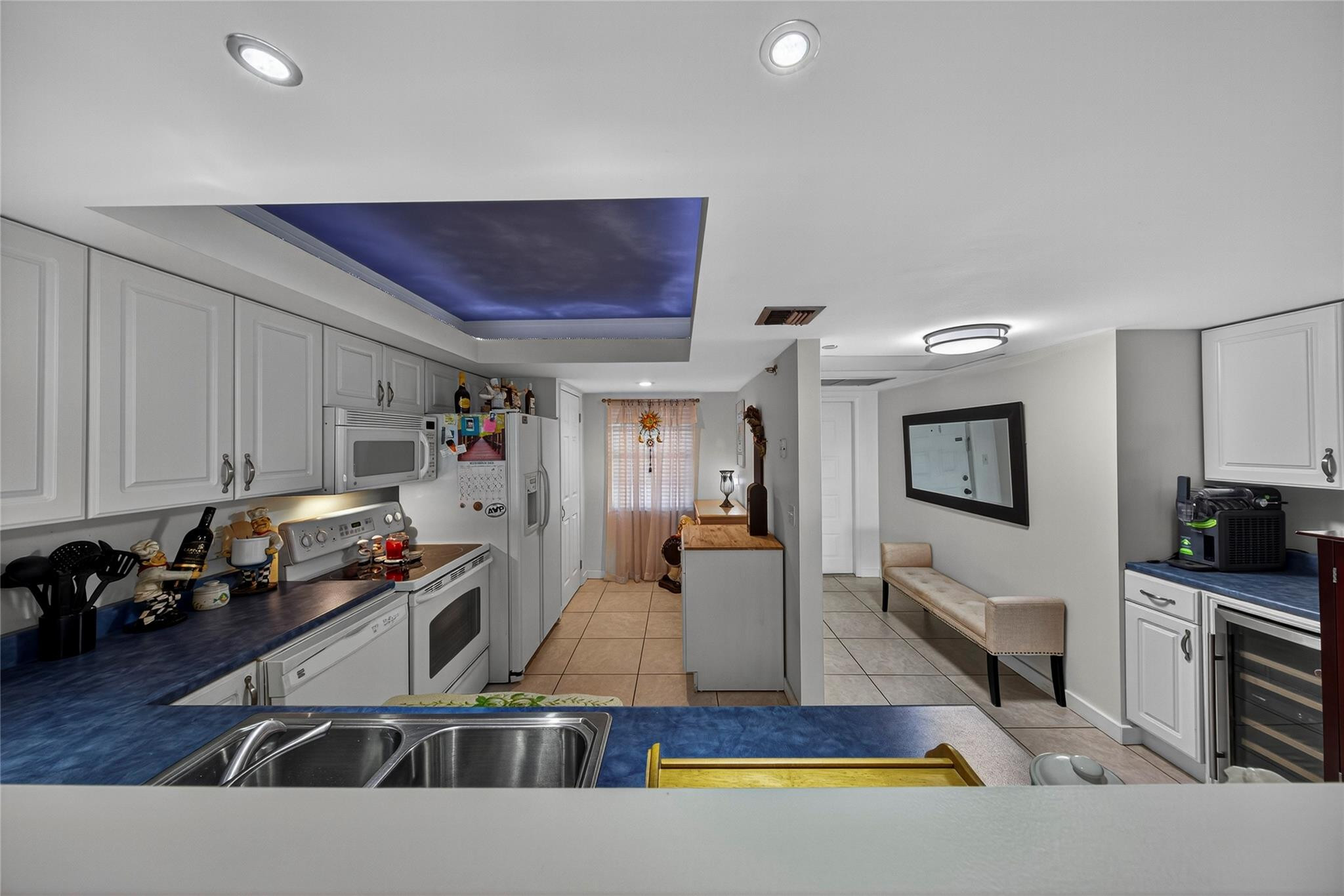 2900 North Course Drive, Unit 607 Pompano Beach, FL 33069 - Photo 17 of 48 a kitchen with stainless steel appliances a sink a stove top oven a counter space and cabinets