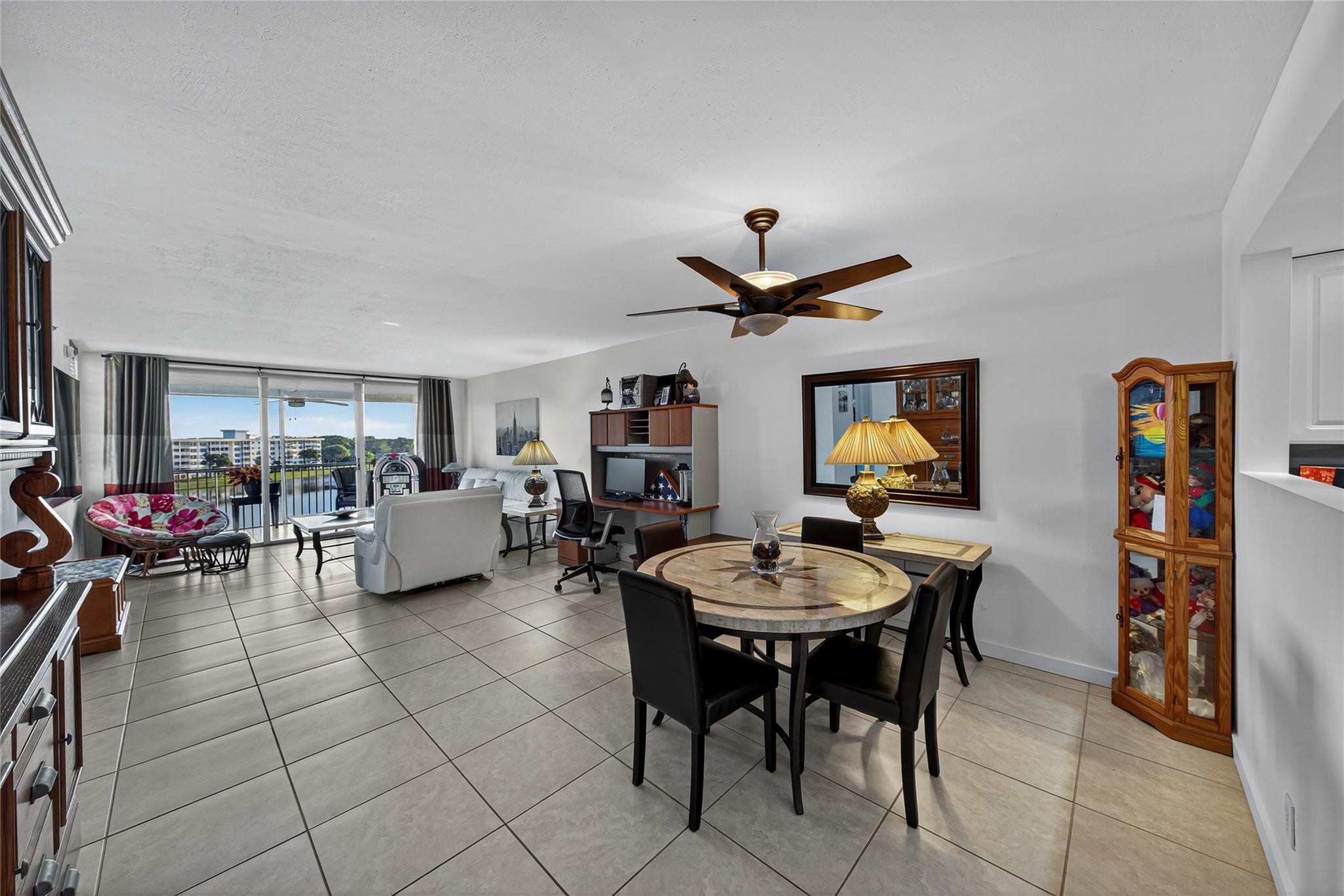 2900 North Course Drive, Unit 607 Pompano Beach, FL 33069 - Photo 20 of 48 a living room with furniture and a flat screen tv