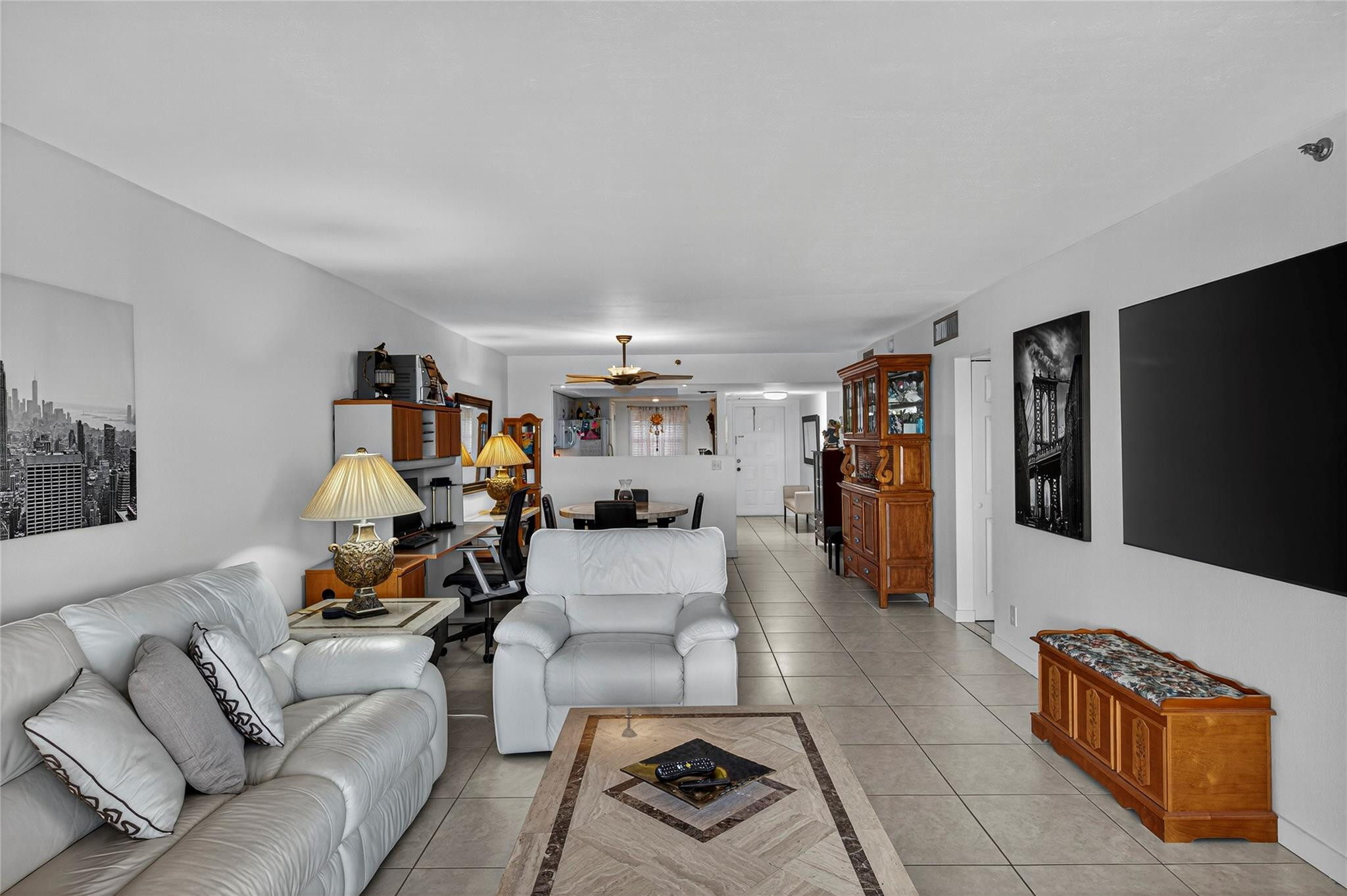 2900 North Course Drive, Unit 607 Pompano Beach, FL 33069 - Photo 27 of 48 a living room with furniture and a flat screen tv