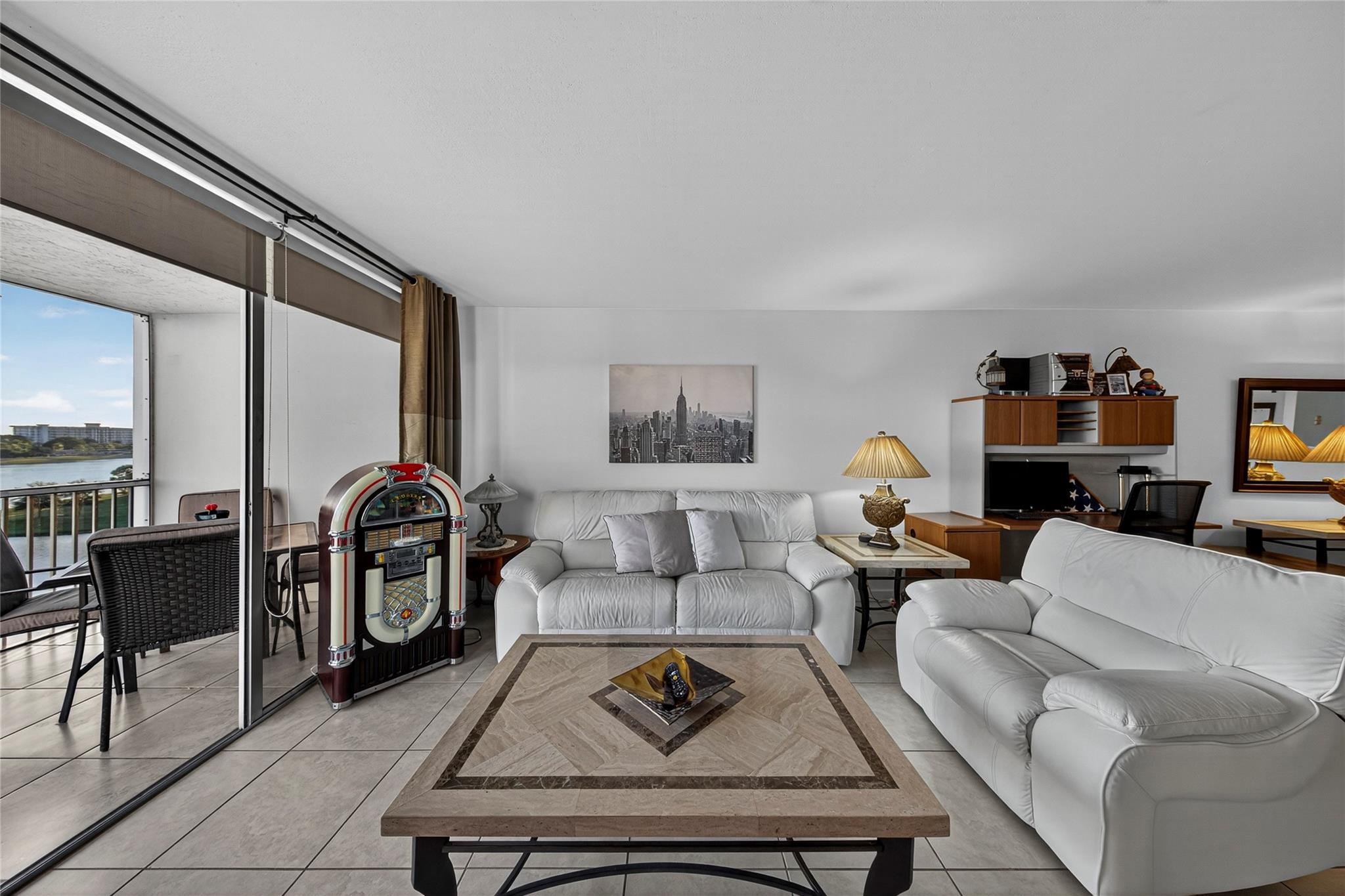 2900 North Course Drive, Unit 607 Pompano Beach, FL 33069 - Photo 30 of 48 a living room with furniture and a rug