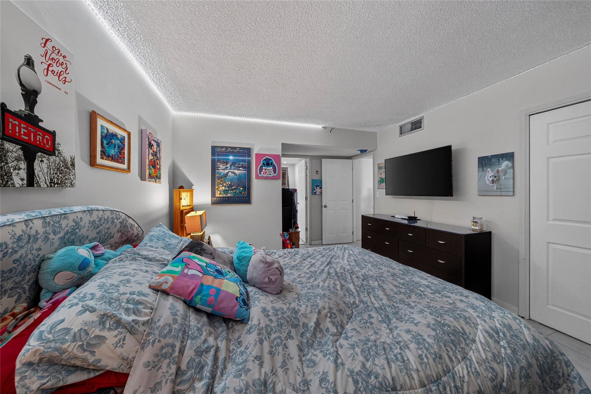 2900 North Course Drive, Unit 607 Pompano Beach, FL 33069 - Photo 37 of 48 a bedroom with two beds and a flat screen tv