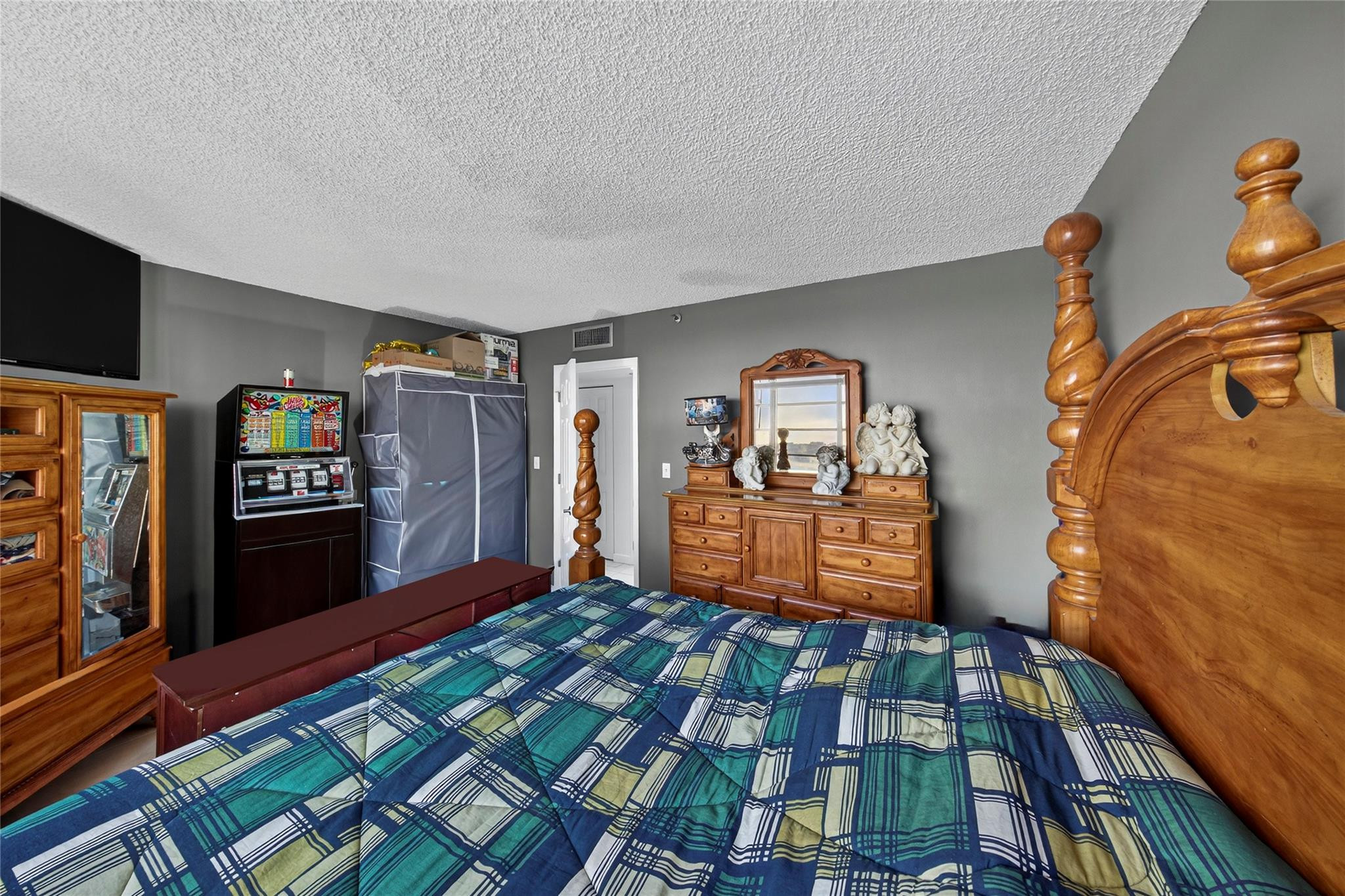 2900 North Course Drive, Unit 607 Pompano Beach, FL 33069 - Photo 44 of 48 a bed room with a bed and a television