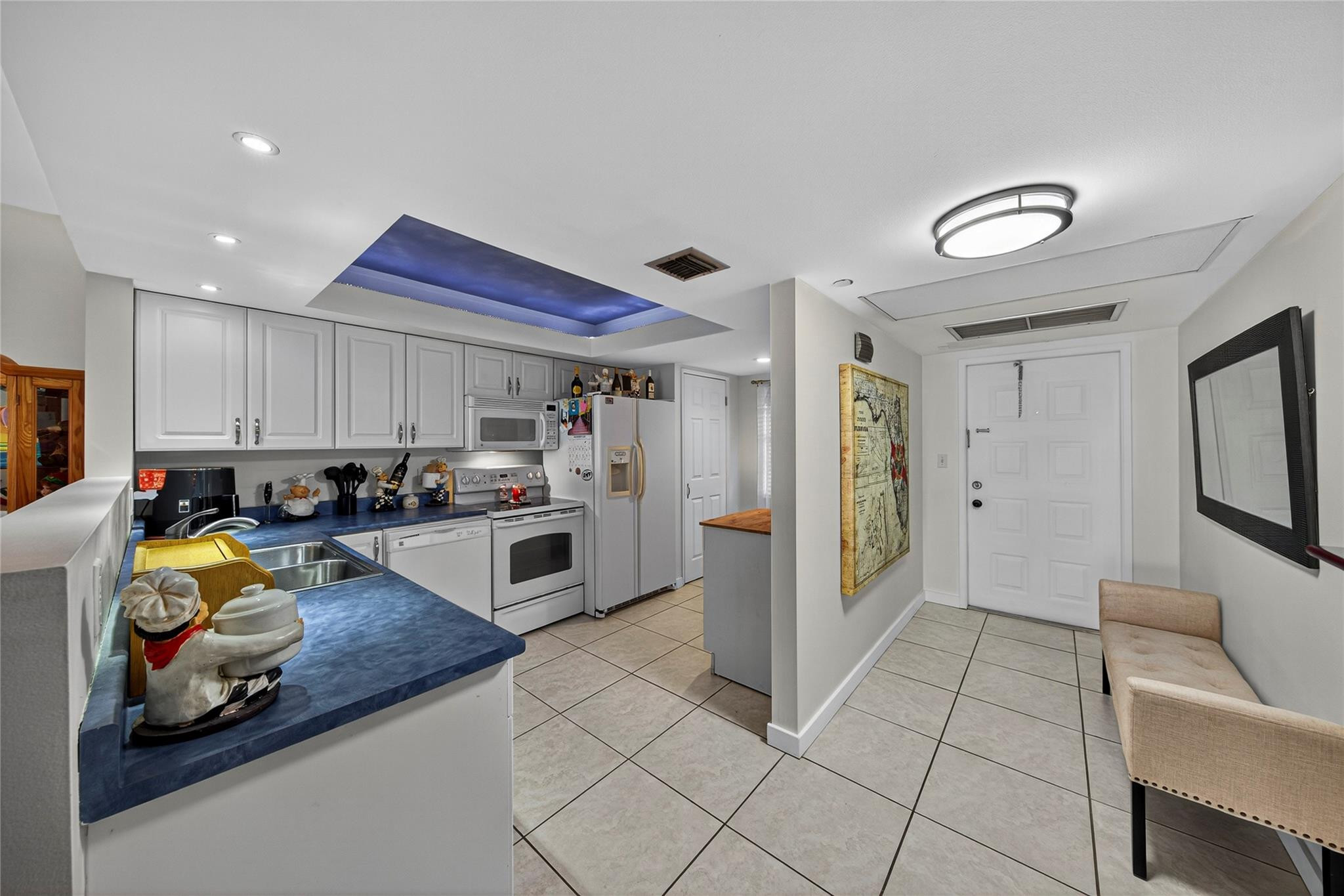 2900 North Course Drive, Unit 607 Pompano Beach, FL 33069 - Photo 7 of 48 a kitchen with stainless steel appliances granite countertop a refrigerator and a stove