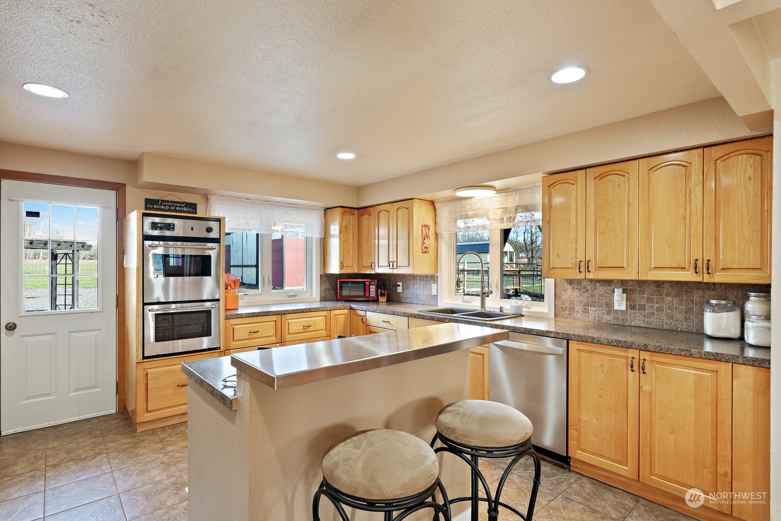 2820 Douglas Road Ferndale, WA 98248 - Photo 11 of 40 a kitchen with a sink cabinets and window