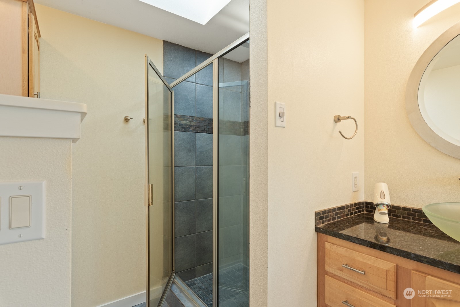 2820 Douglas Road Ferndale, WA 98248 - Photo 17 of 40 a bathroom with a granite countertop sink and a mirror