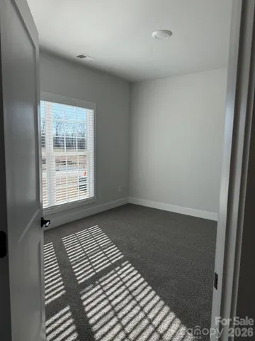 an empty room with wooden floor