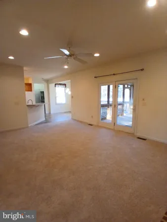 a view of a big room with windows and cabinet