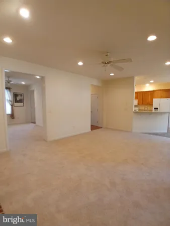 a bathroom with a sink and mirror with toilet