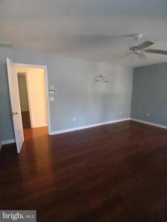 an empty room with wooden floor
