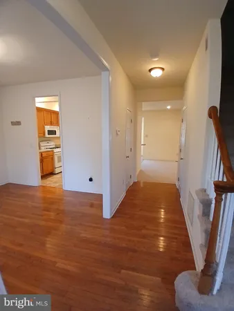 a view of entryway with wooden floor