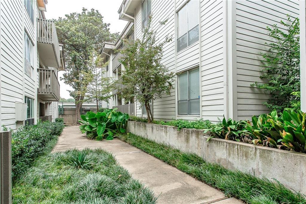 4859 Cedar Springs Road, Unit 355 Dallas, TX 75219 - Photo 1 of 1 a view of a garden with a fountain