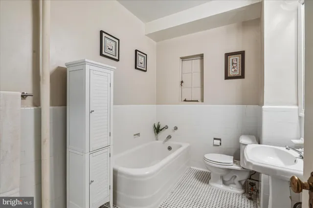 a bathroom with a shower and a sink