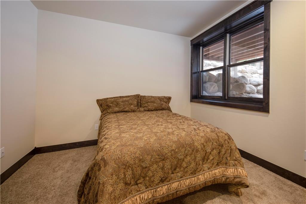 687 Independence Road Keystone, CO 80435 - Photo 16 of 26 a bed sitting in a bedroom next to a window