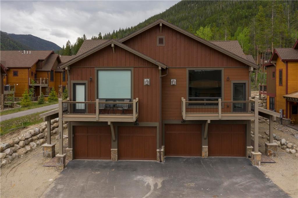 687 Independence Road Keystone, CO 80435 - Photo 23 of 26 a front view of a house with a yard