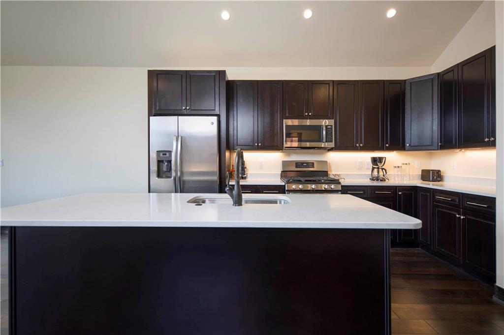 687 Independence Road Keystone, CO 80435 - Photo 5 of 26 a kitchen with stainless steel appliances a sink stove and refrigerator