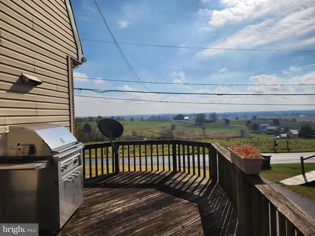 a balcony with wooden floor