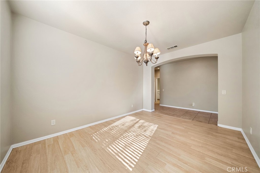 3175 Sand Pine Trail Hemet, CA 92545 - Photo 5 of 31 a view of an empty room with wooden floor